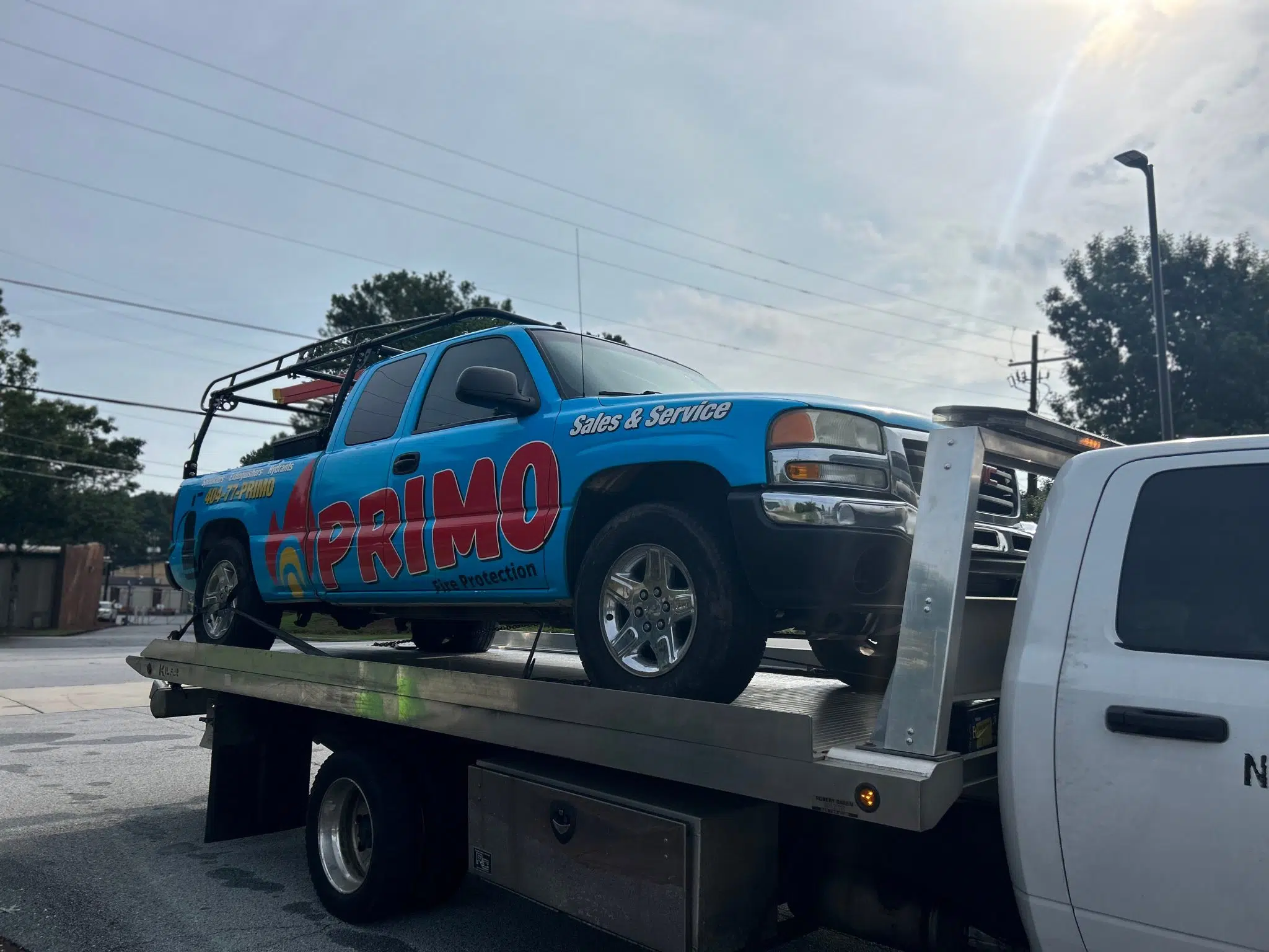 Vehicle is on the tow truck and tow by Amanah Towing