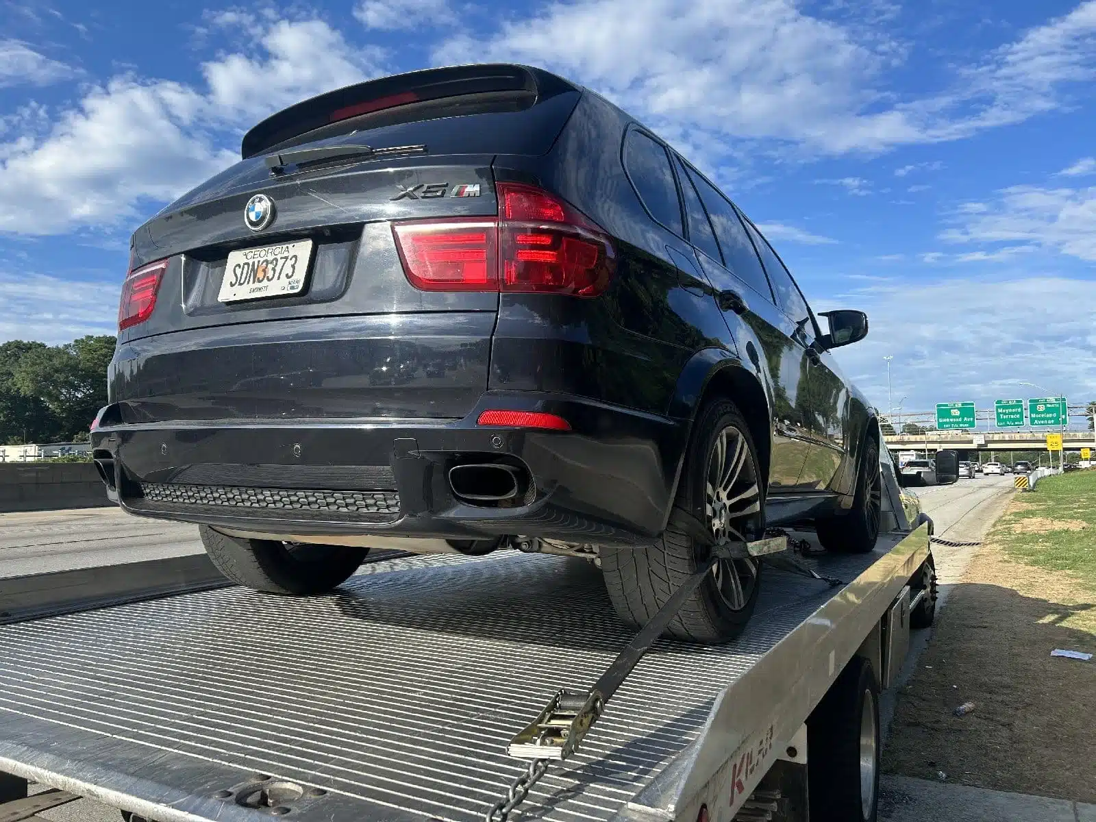 Car image while towing by Amanah tow team.